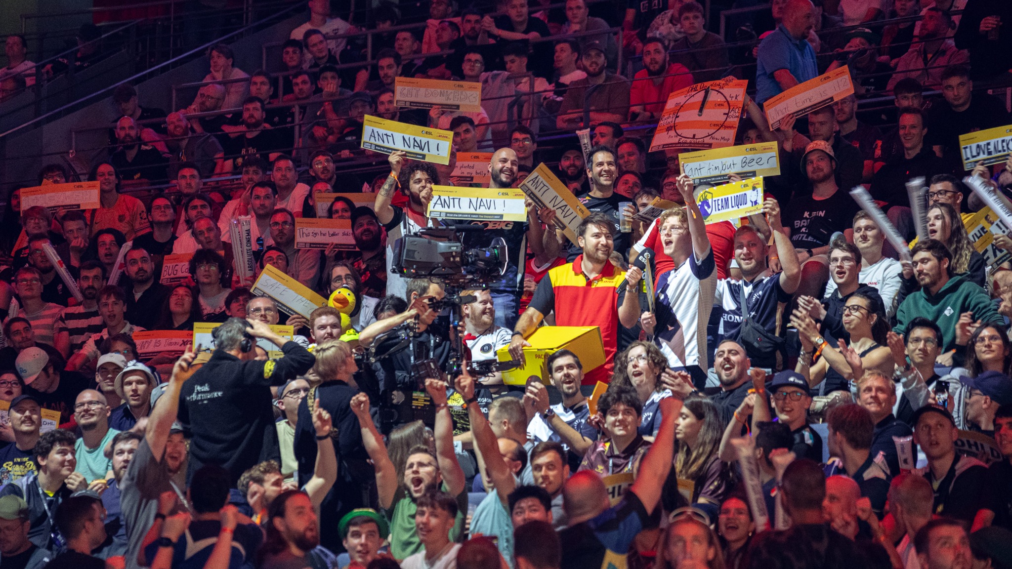 Esports crowd with signs, cameras and presenters
